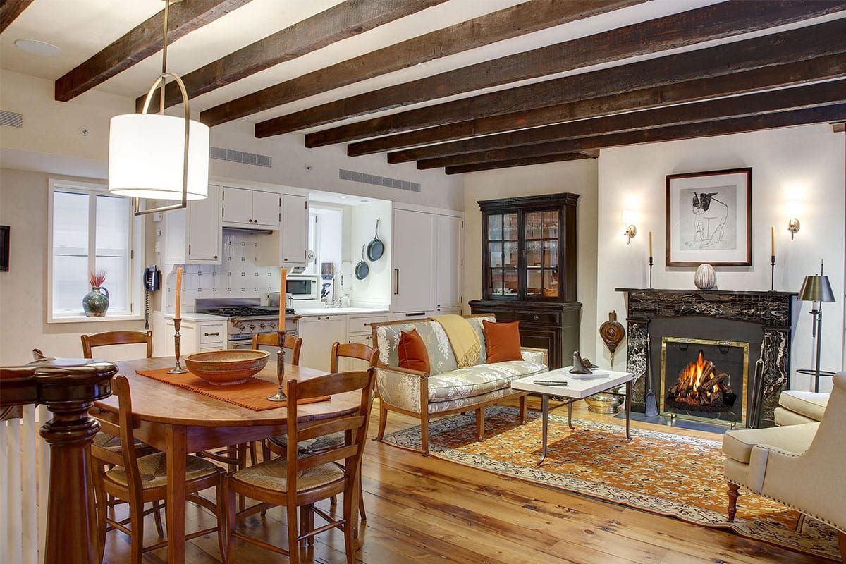 Beamed kitchen and living room with a working fireplace