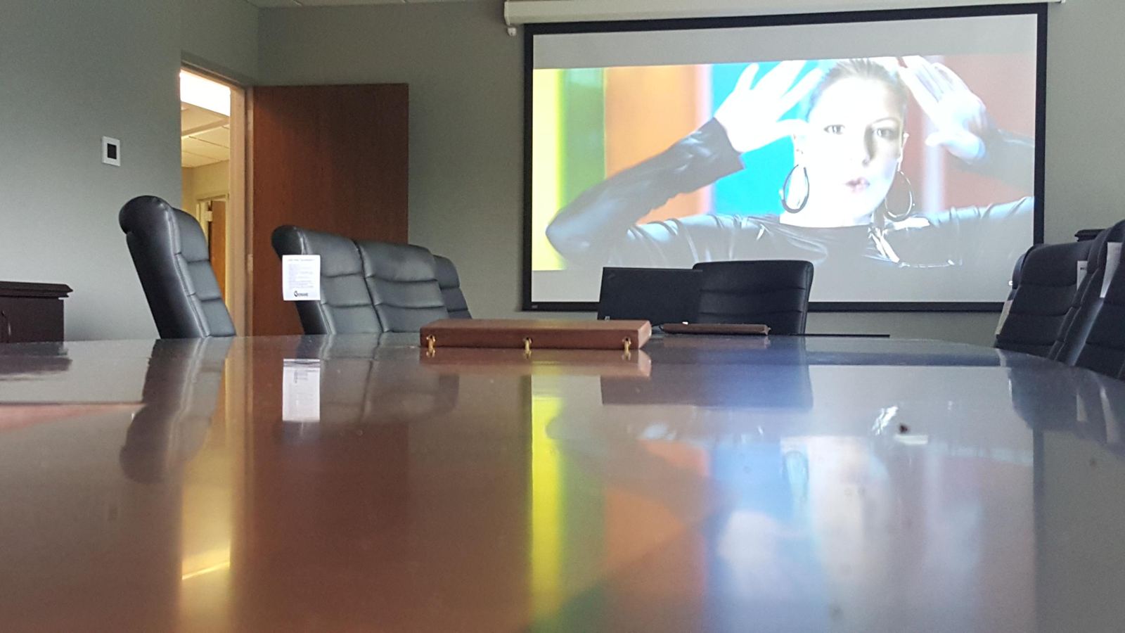 Conference room with drop-down projection screen