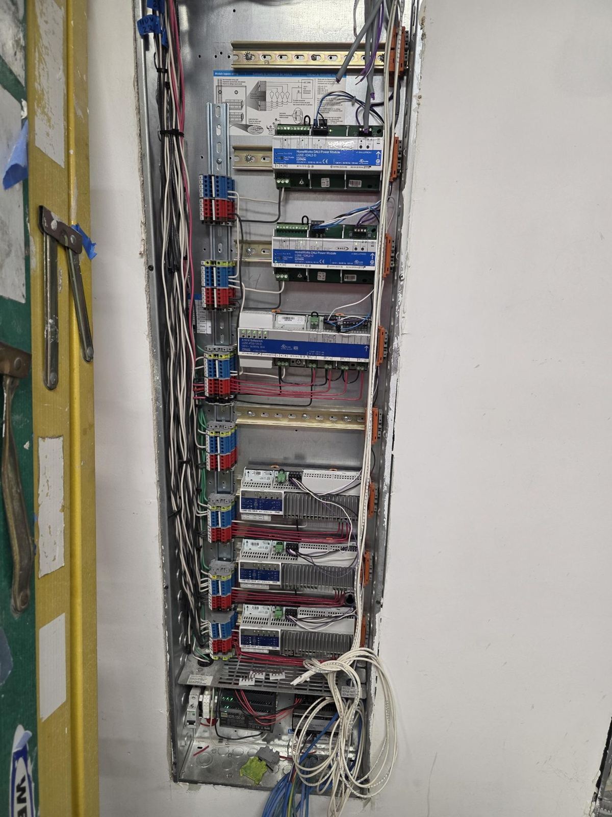 Equipment rack wired and labeled inside a wall closet