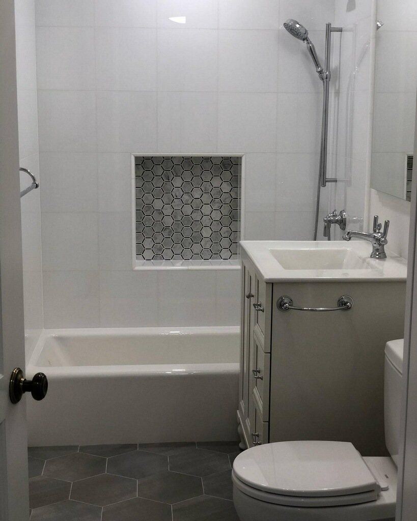 Bath with hex mosaic niche and large hex floor tile