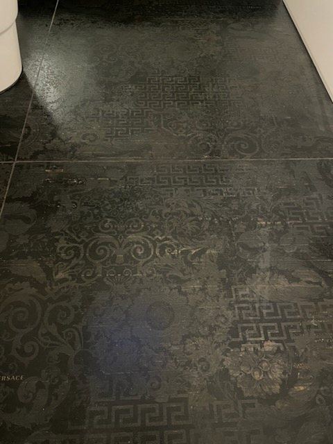 Black patterned porcelain floor tile